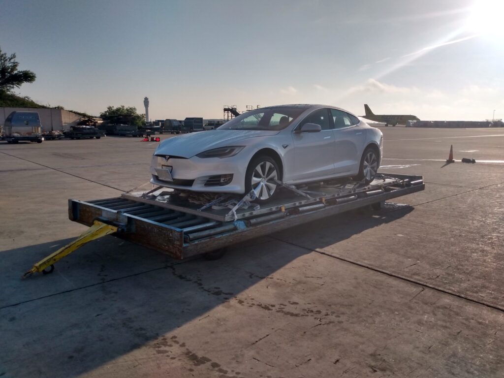 Gray Electric Tesla Vehicle on Trailer