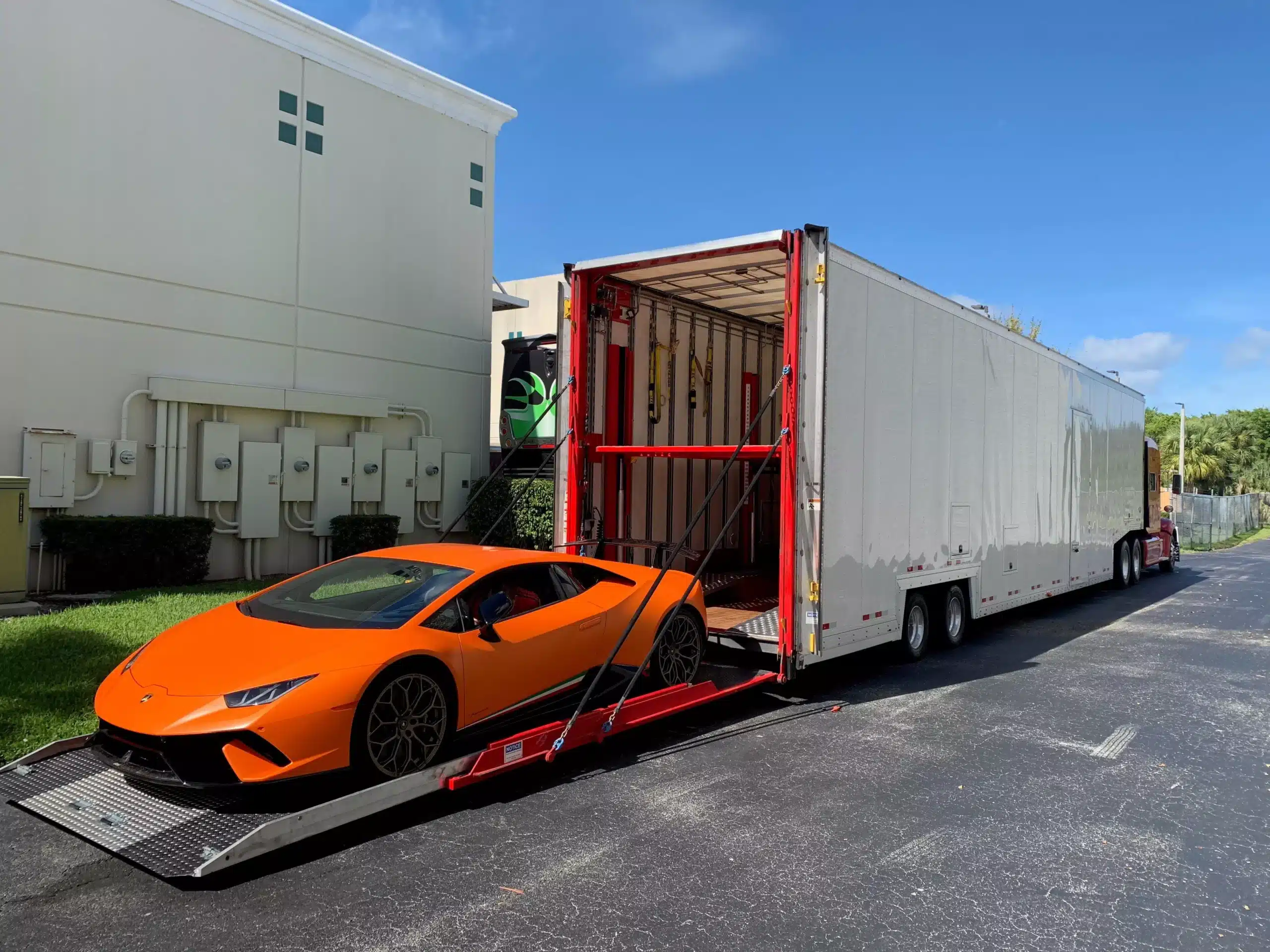Enclosed transport carrier with high-value vehicle in Texas